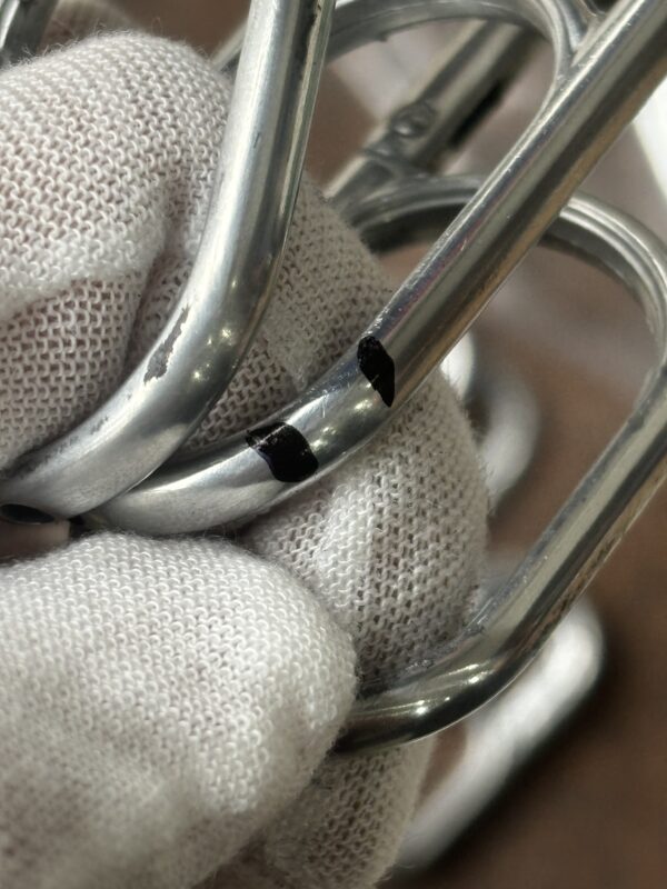 Scratches on the surface of the dog hook